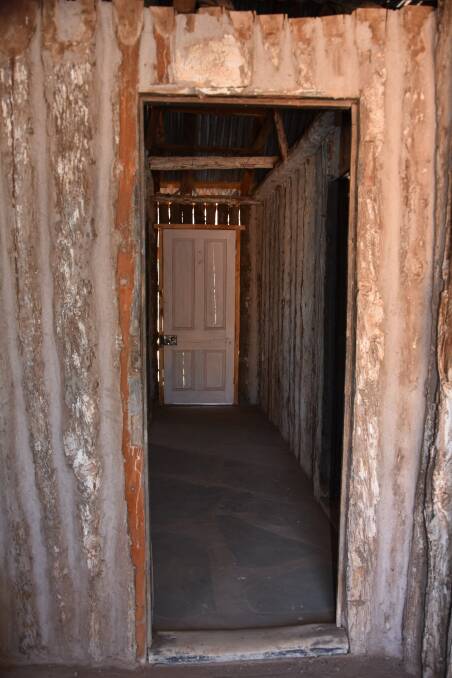 LOOK THROUGH TIME: The worn doorstep and old pines show the history in the cottage.